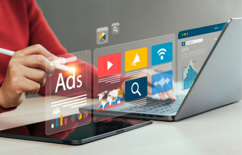 Hand interacting with virtual ad icons for digital marketing – FlowerinDigital, a digital marketing agency in Chennai.