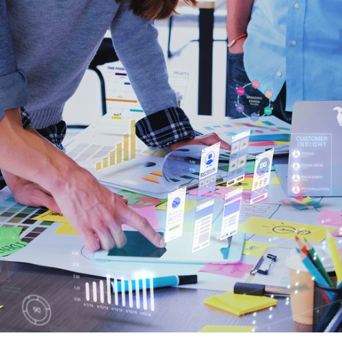 Creative minds at a digital marketing agency in Chennai collaborating on futuristic strategies using analytics and customer insight tools.